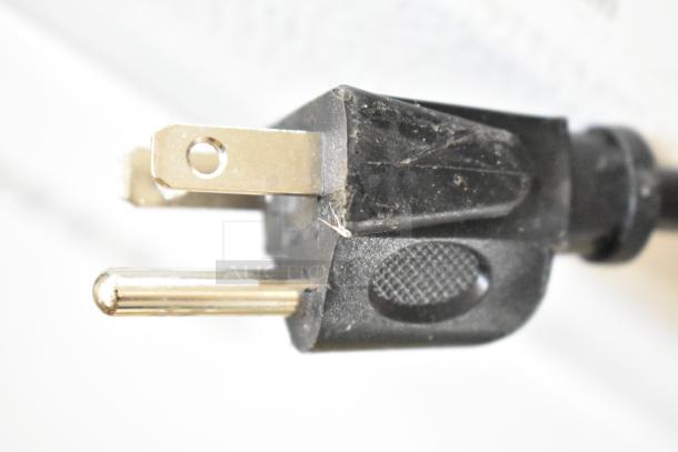 Close-up of a power plug for a Vissani HVAR43GSE Mini Cooler, 115 Volts, 1 Phase. Plug is black with metallic prongs.