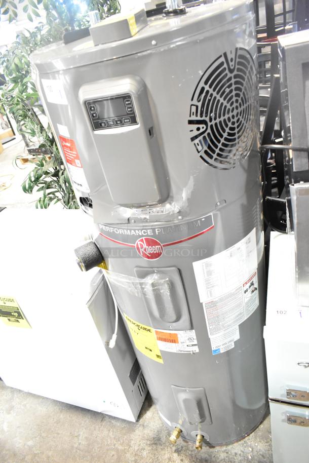 Rheem RSB565E Hot Water Heater, gray, with control panel and energy guide label. Model RSB565E. Excellent condition.
