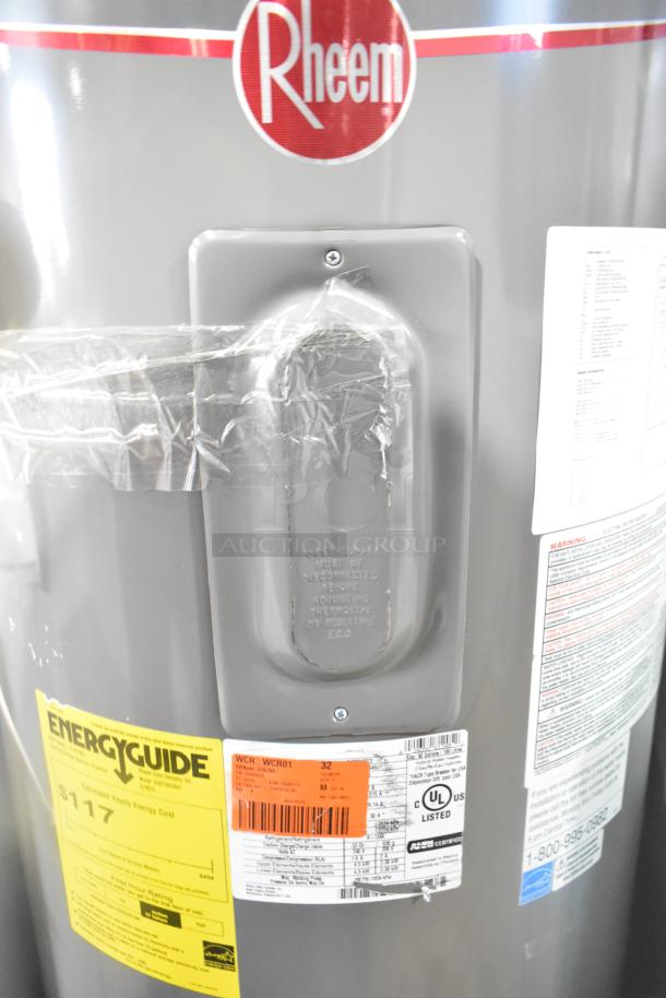 Rheem RSB565E hot water heater, features EnergyGuide label, new condition. UL listed with safety instructions visible.