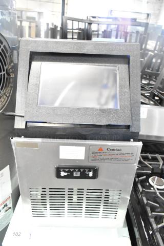 WQ30FT Commercial Undercounter Ice Machine, 110V, 1 Phase. Features control panel and caution label.