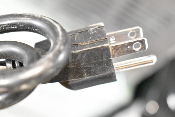 Plug of WQ30FT Commercial Undercounter Ice Machine, 110 Volts, 1 Phase, showing three-prong configuration.