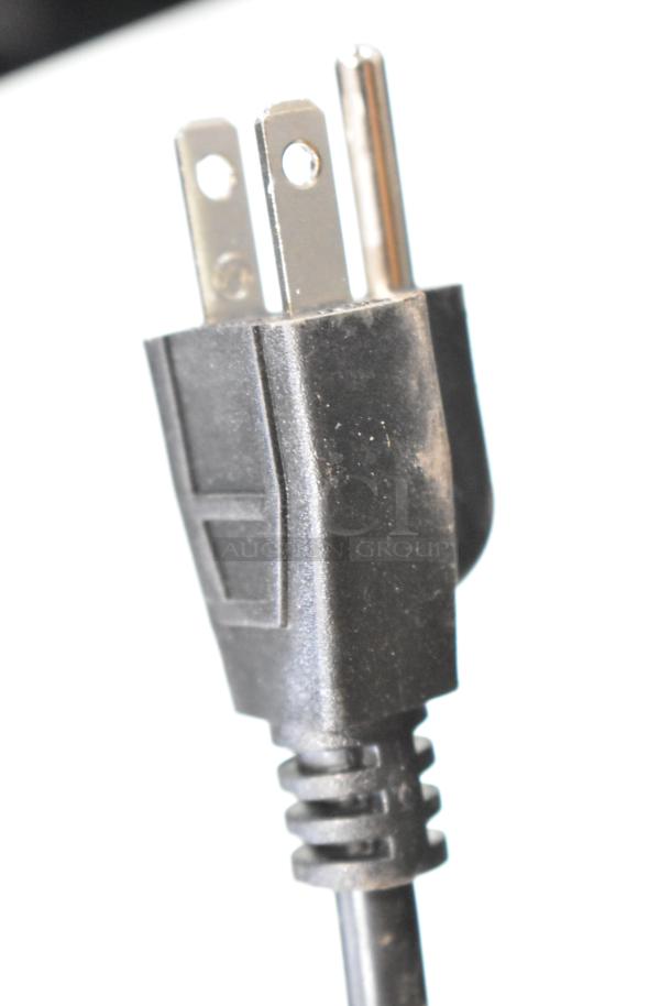 Close-up of a three-prong plug from the Frigidaire EFR840-MINT-6COM Mini Cooler, 115 Volts, brand new condition.