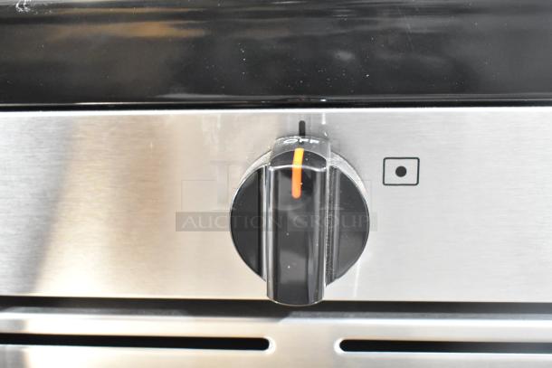 Frigidaire FCRG3052BSF range control knob on stainless steel panel, showing off position. Clean, well-maintained condition.