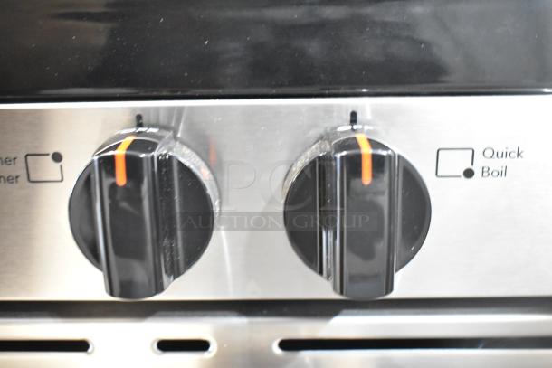 Frigidaire FCRG3052BSF range control knobs, showing stainless steel finish and "Quick Boil" feature marking.