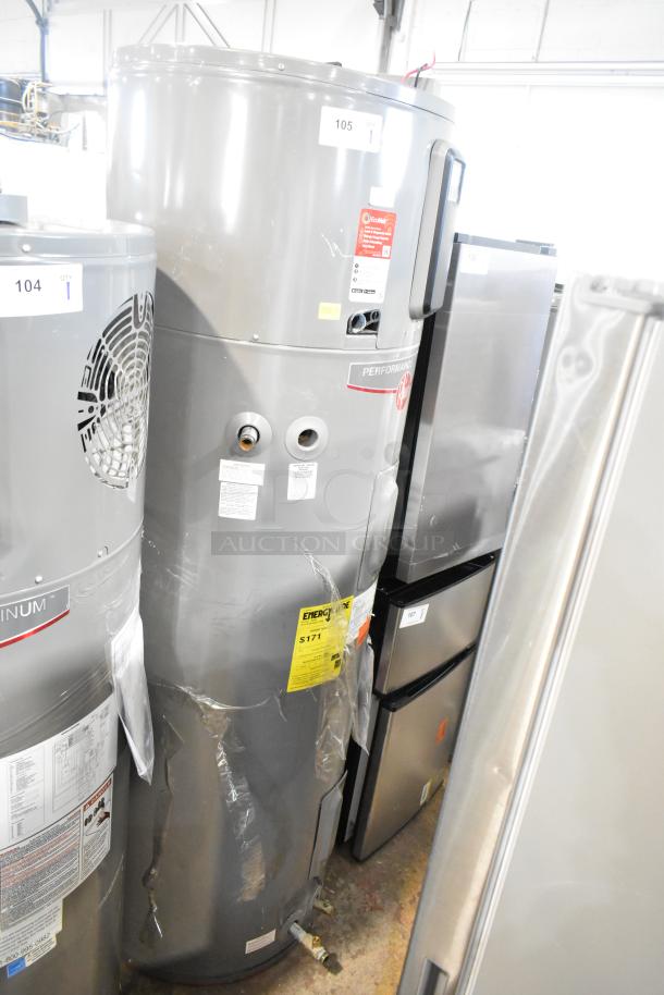 Rheem COC1I8V Hot Water Heater, 208/240V, grey cylinder, visible labels indicating energy efficiency and model details.