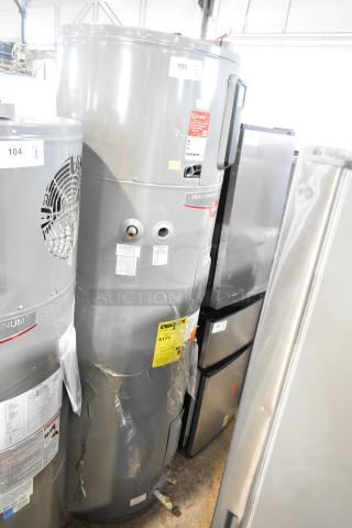 Rheem COC1I8V Hot Water Heater, 208/240V, grey cylinder, visible labels indicating energy efficiency and model details.