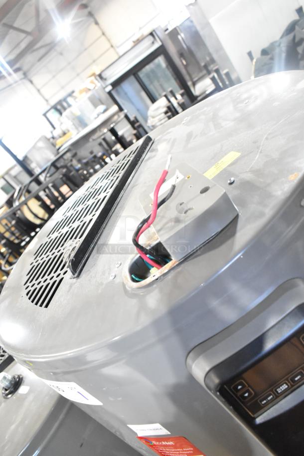 Rheem COC1I8V hot water heater, 208/240 volts, visible wiring and control panel. Used condition with factory label.