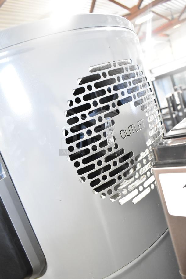 Rheem COC1I8V hot water heater, 208/240 volts, silver finish, visible outlet vent, good condition.