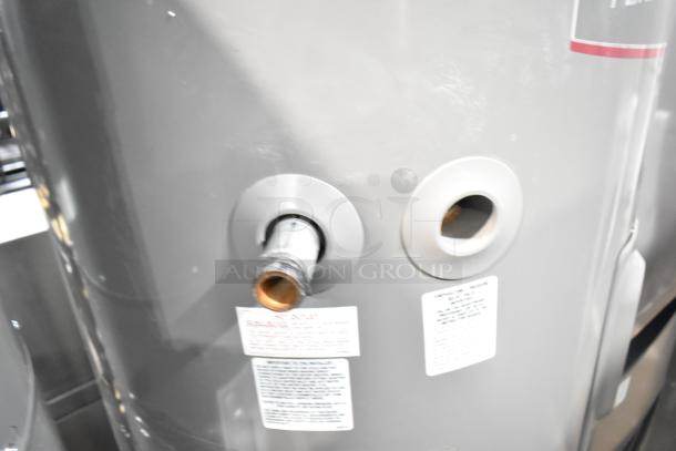 Rheem COC1I8V hot water heater, 208/240 volts, gray finish, visible labels, good condition.