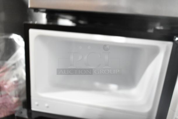 Vissani MDCM31SS5 mini cooler with freezer, 115 volts, 1 phase. Brand new, scratch and dent condition, open interior view.