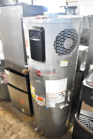 Rheem ProTerra Performance Platinum hot water heater, grey, with digital control panel, tags and labels visible, in good condition.