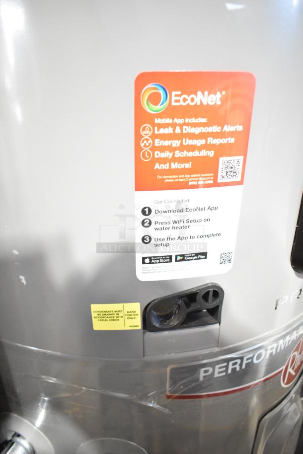Rheem hot water heater with EcoNet app integration, offering leak alerts and energy reports. New condition, gray exterior.