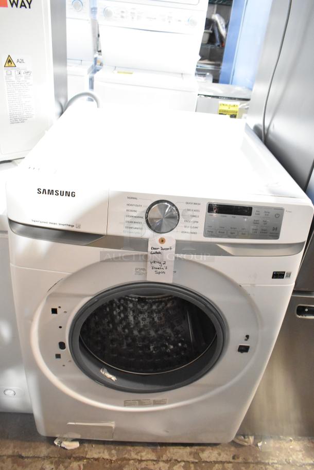 Brand new Samsung WF45B6300AW/US front load washer. Minor scratches and dents visible. Note: "Door doesn't latch."