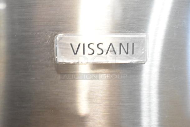 Vissani MDBF18SS nameplate on stainless steel surface, indicating brand of the reach-in cooler with freezer drawer.
