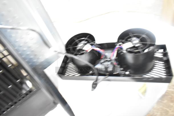 Black AirCare fan with dual motors and visible wiring; in good condition. Suitable for ventilation.