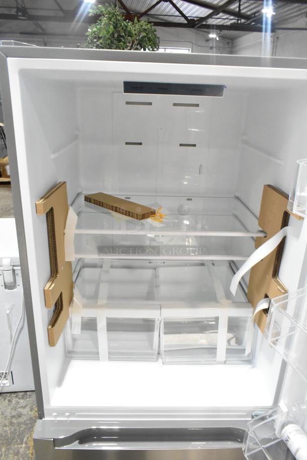 Brand new Vissani MDBF18SS reach-in cooler with freezer drawer, visible packing materials, 115 volts, 1 phase, scratch and dent condition.