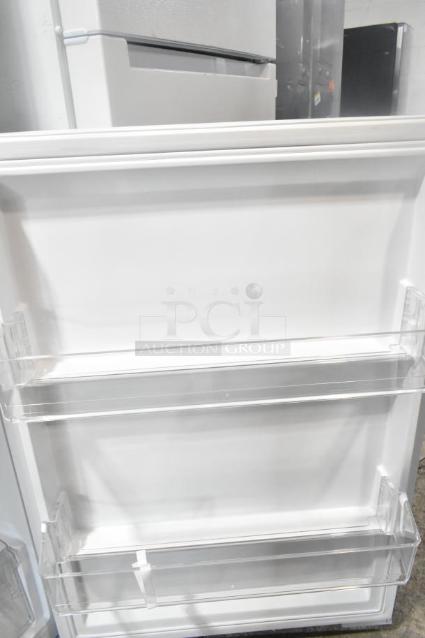 Vissani MDTF14WH5 reach-in cooler with freezer, brand new with minor scratches. Visible shelving, 115V, 1-phase power.