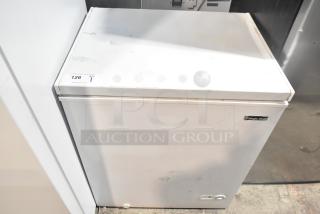 Magic Chef HMCF5W4 chest freezer, 5.0 cu. ft., 115V, new with scratches and dents, visible brand label and auction tag.