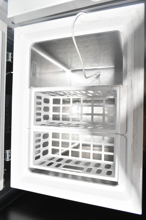 Brand new Magic Chef HMCF5W4 5.0 cu. ft. chest freezer. Features dual baskets. Scratch and dent condition.