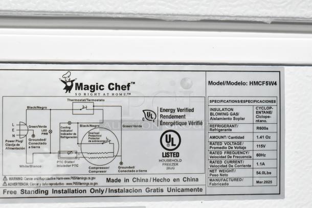 Magic Chef HMCF5W4 5.0 cu. ft. chest freezer, new with scratch and dent. Labels show electrical specs and UL listing.