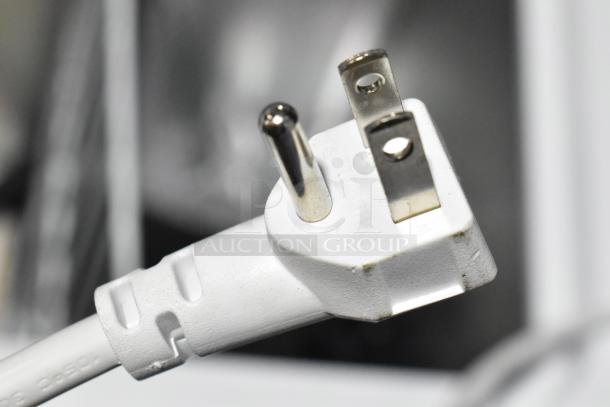 Close-up of a white power plug labeled "Wiltronic" for the Vissani HMCF7W5 chest freezer.