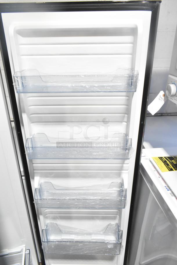 Vissani VSF11US2A16 convertible cooler/freezer, brand new with scratch and dent. Includes door storage shelves and plastic wrap.