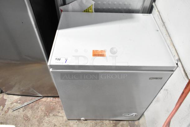 Brand new 2025 Magic Chef HMCF5W4 5.0 cu. ft. chest freezer, 115 volts, with minor cosmetic dents. Item sticker visible.