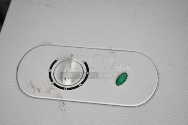 Close-up of control dial on 2024 Vissani HMCF5W5 chest freezer, showing manual defrost settings. Slight surface scratches visible.