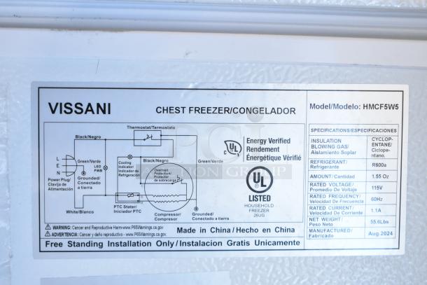Label on Vissani HMCF5W5 chest freezer, detailing specs: manual defrost, 115V, R600a refrigerant, 55.6 lbs, made Aug. 2024.