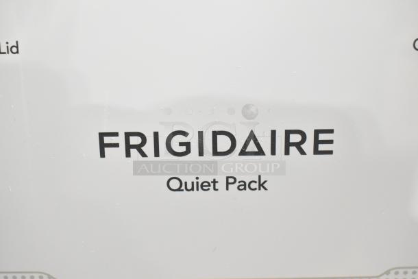 BRAND NEW Frigidaire stacked washer and dryer, top load washer, front load dryer, with minor scratches. Quiet Pack feature.