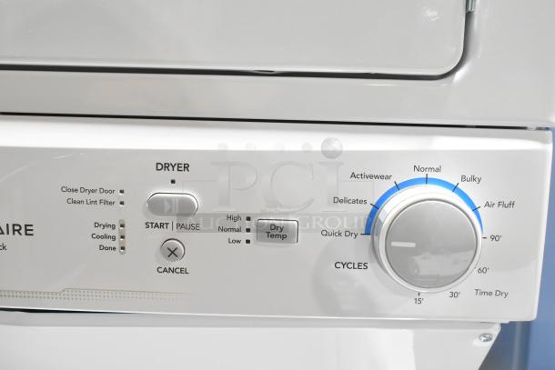 Brand new Frigidaire stacked top-load washer and front-load dryer control panel. Featuring various cycles and settings.