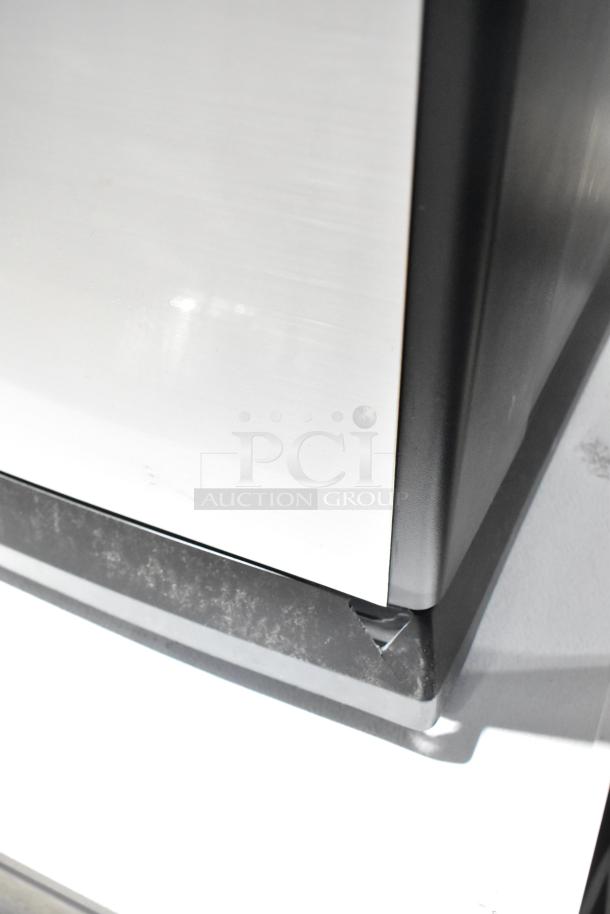 HD1409 Evaporative Humidifier, 120 Volts, model HD1409. Features black and silver exterior. Minor wear on base.