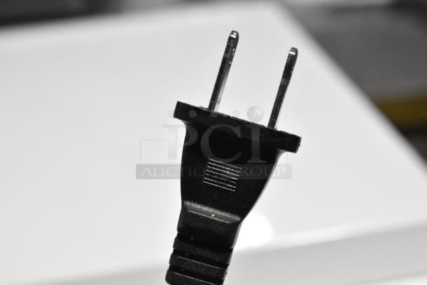 Close-up image of a power plug from an HD1409 Evaporative Humidifier, suitable for 120 volts, 1 phase.