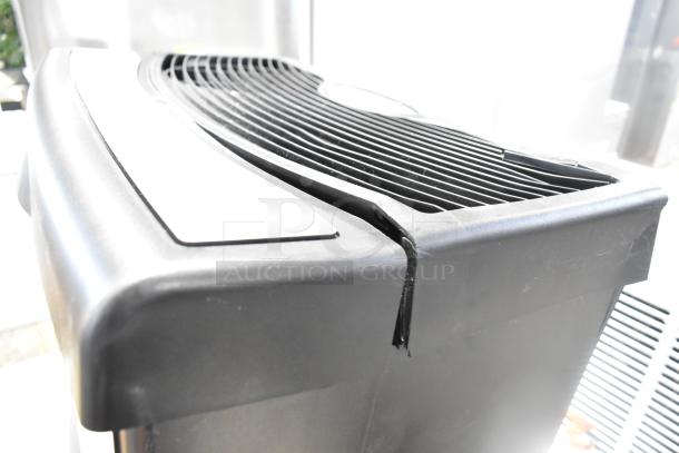 HD1409 Evaporative Humidifier, 120V, model HD1409, black casing, visible crack, used condition. Ideal for home use.