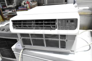 LG LW1022IVSM window air conditioner, 10,000 BTU, 115 volts, control panel visible, apparent good condition.