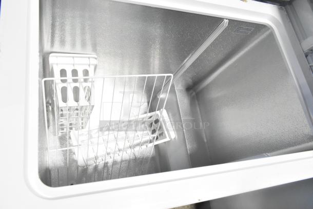 Brand new Vissani HMCF7W5 chest freezer, 7.0 cu. ft., 115V. Manual defrost, scratch and dent condition. Interior view.