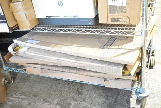 Nine boxes of 3M Easel Pad, Pacon Railroad Board, Pacon Presentation Board, and Super Value Poster, scratch and dent condition, on a metal cart.