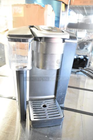 Keurig K-4550 single cup coffee machine, 120V, black and silver, countertop model. Slight wear, ideal for office use.