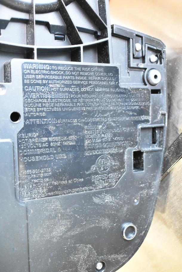 Keurig K-4550 single cup coffee machine label showing model number, voltage, and usage warnings.