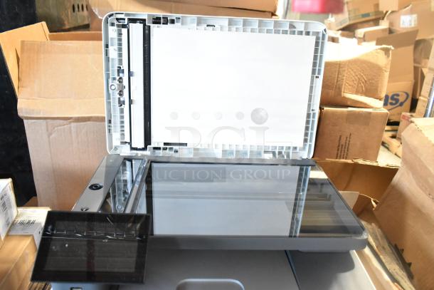 HP Color LaserJet MFP 3301sdw, open scanner lid, copier printer, excellent condition, surrounded by packing boxes.