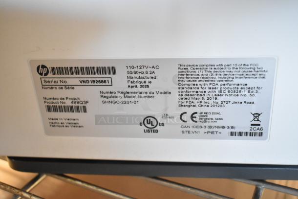 HP Color LaserJet MFP 3301sdw label showing serial number VND1B26861, product no. 499Q3F, manufactured April 2025.
