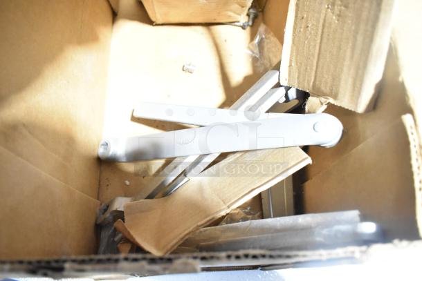 Box containing assorted items, including an Ingersoll-Rand 4041 and Norton 1601 door closer, in used condition.