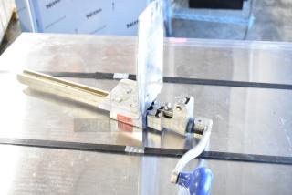 Edlund commercial can opener with mount, stainless steel, manual operation, appears in good condition, Edlund brand visible.