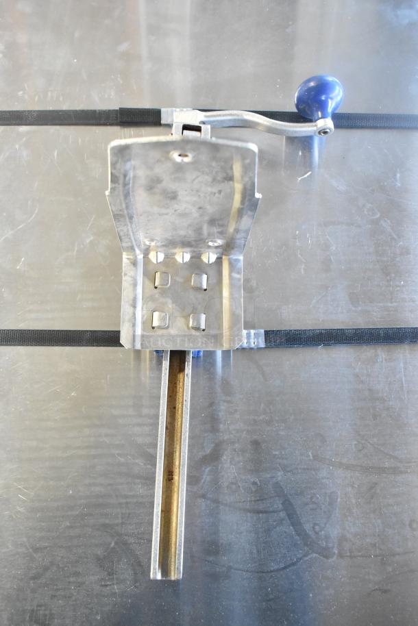 Edlund commercial can opener with mount, featuring a blue handle. Appears in good condition, ideal for heavy-duty use.