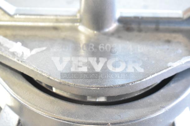 Vevor Countertop Vegetable Slicer in used condition, visible brand marking on metallic surface.