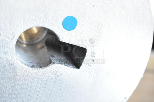 Commercial dough hook attachment for Hobart mixer, metal, used. Shows a circular engraving "CHINA" and blue dot sticker.