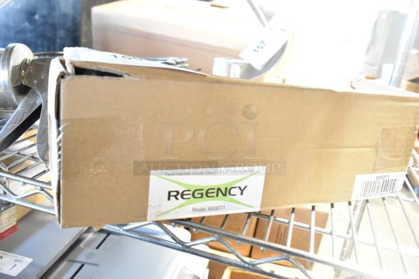 Brand new Regency 600DT1 twist handle waste valve for 3 1/2" sink opening, shown in original packaging with minor dents.