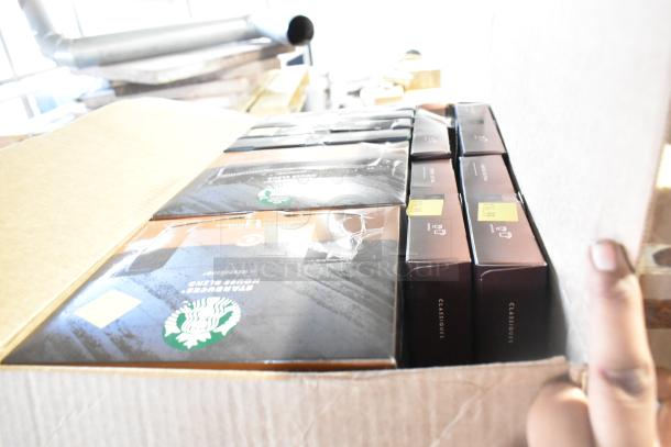 Box of mixed items: Skinny Pop Pretzels, Dots, and LavAzza Vanilla Latte Mix, brand new, slight packaging dents visible.