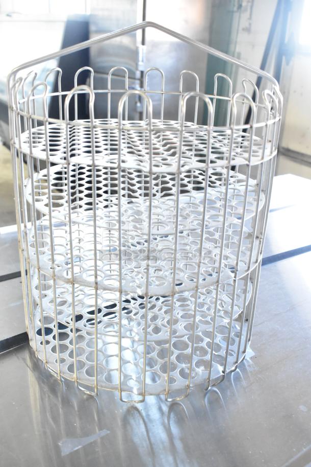 Brand new metal rack with scratch and dent. Features circular metal design. Excellent for storage or display.