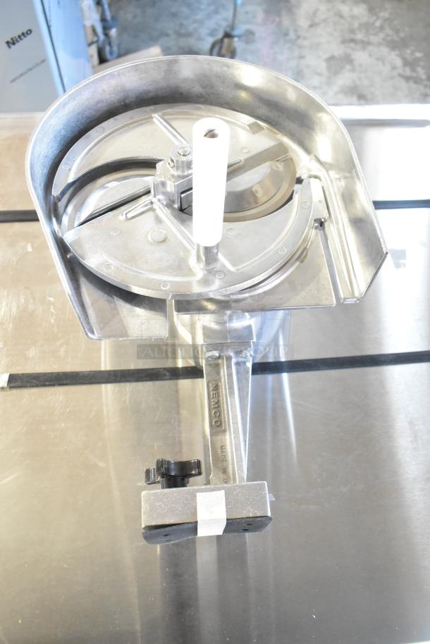 Brand new Nemco 55200AN vegetable slicer, scratch and dent condition. Features stainless steel construction and ergonomic handle.